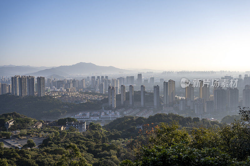 city ​​buildings in morning mist